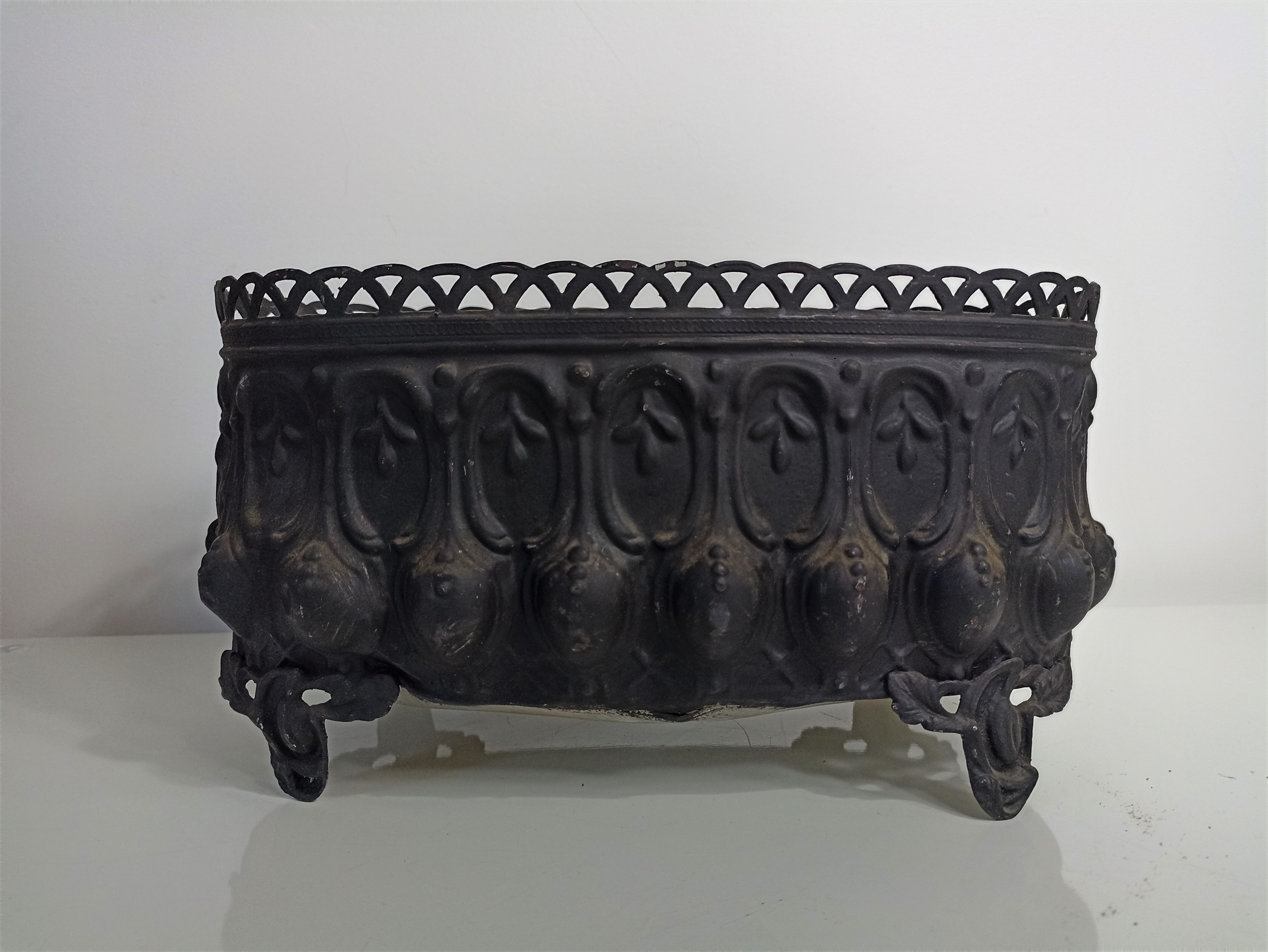 Old black iron planter