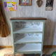 Grey-green bib, dark wood and Toile de Jouy.
