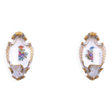A pair of porcelain wall lamps from Capodimonte, Italy.
