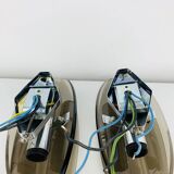 Pair of smoked glass and chrome wall lights from the 1970s.