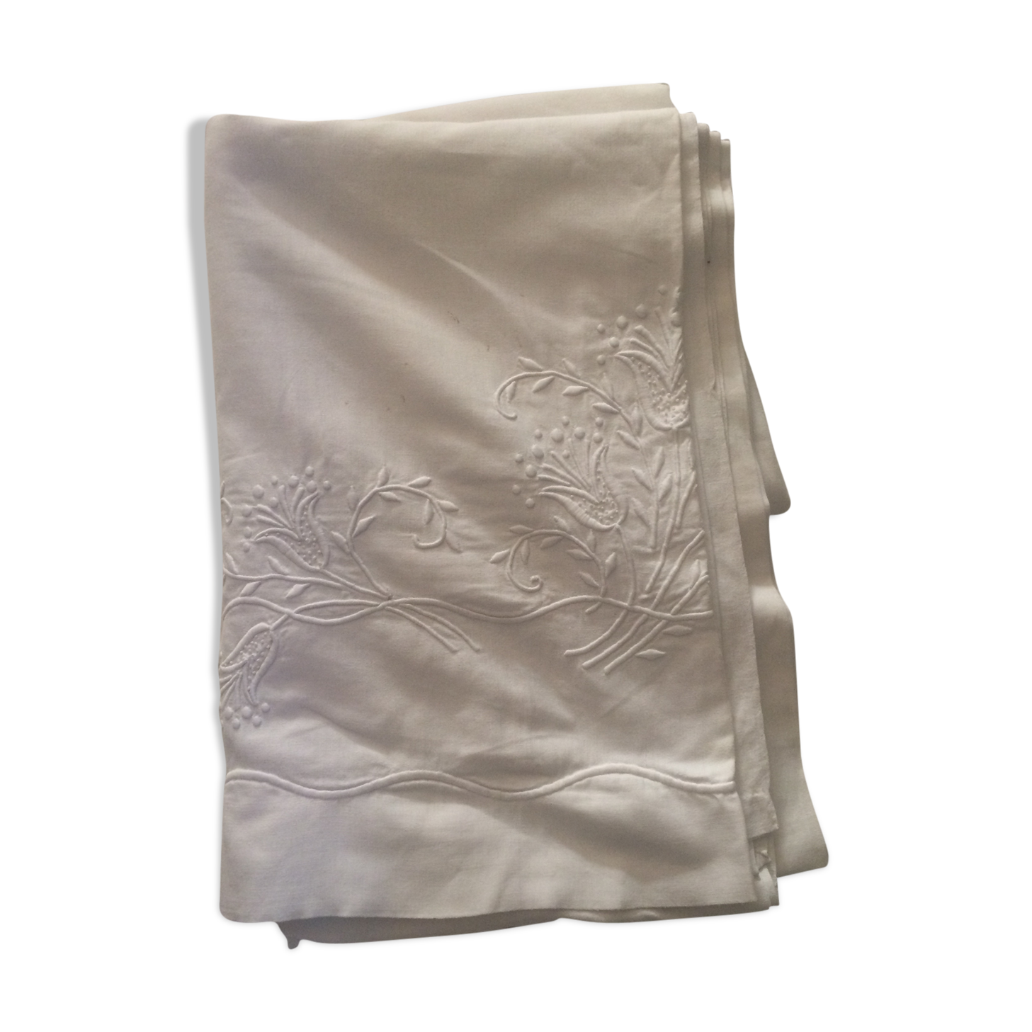 Old sheet with hand made embroidery, shaped flowers.