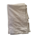 Old sheet with hand made embroidery, shaped flowers.