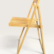 Blonde wooden folding chair in the style of Aldo Jacober.