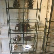 Pair of wrought iron and glass bookshelf shelves.