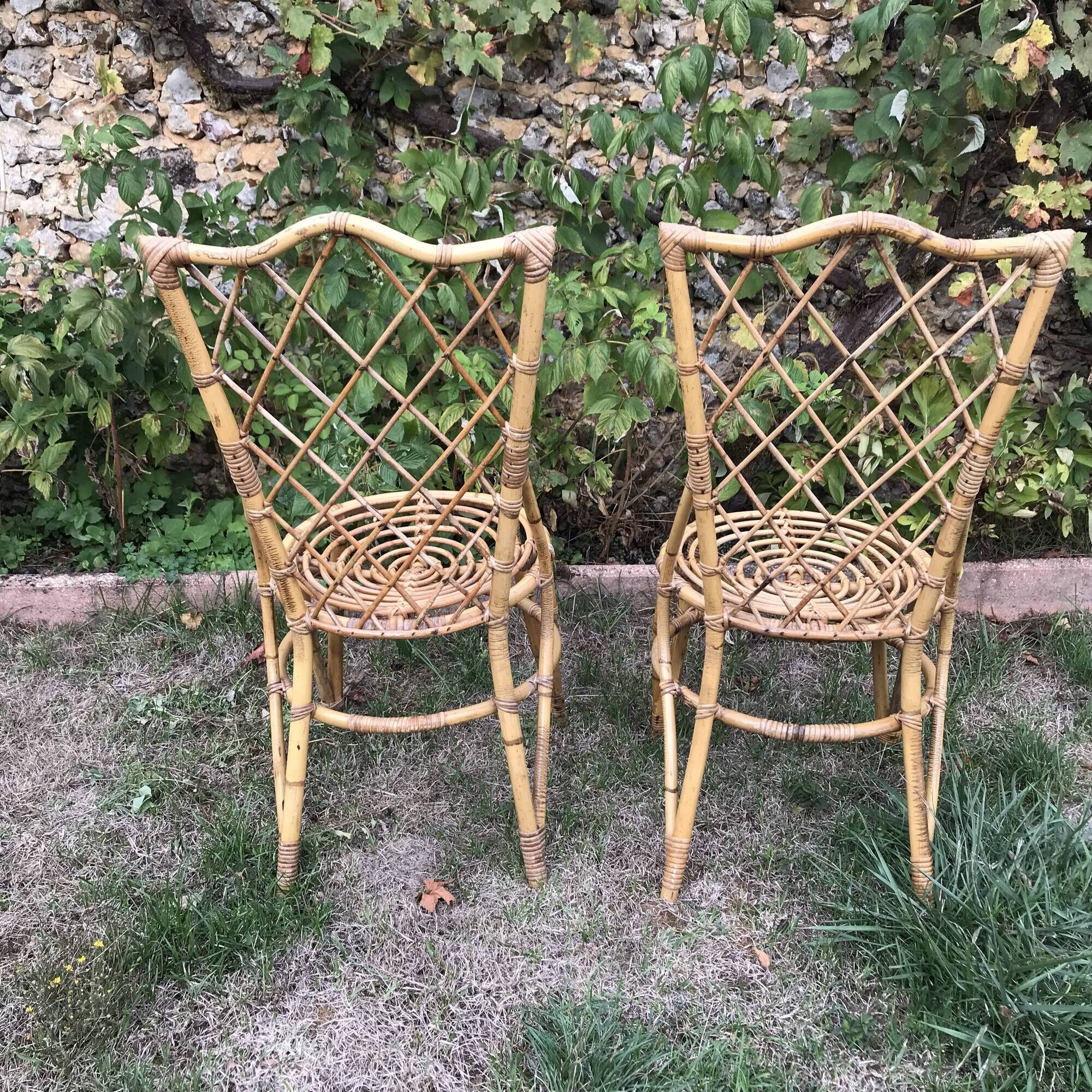 Pair of Louis Sognot chairs in vintage rattan 1960
