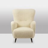 Armchair, or bergère, with its boucle fabric. 1950s