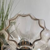 Table lamp with an antique star-shaped globe and a black base