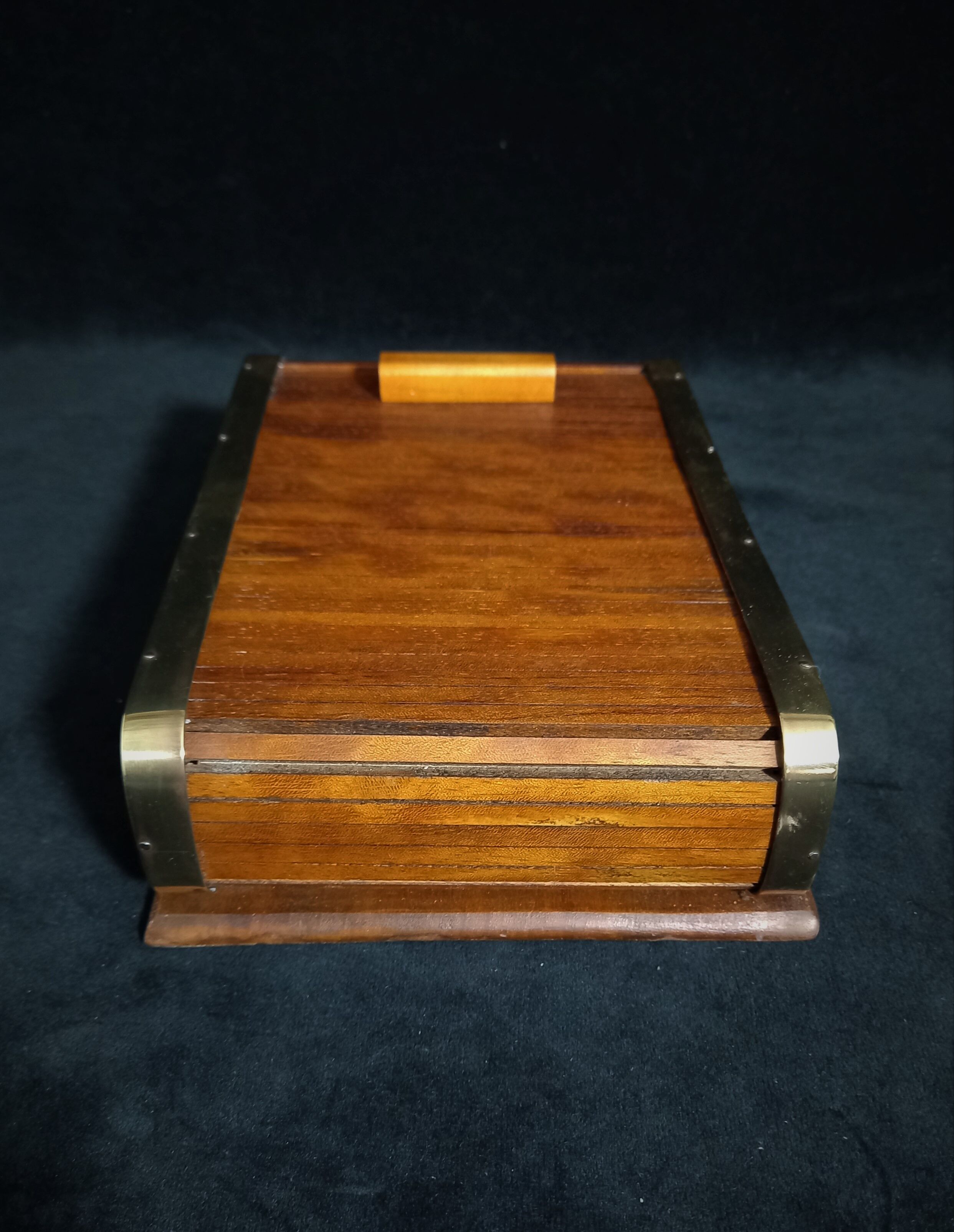 Art deco cigar box with sliding lid and brass finishes