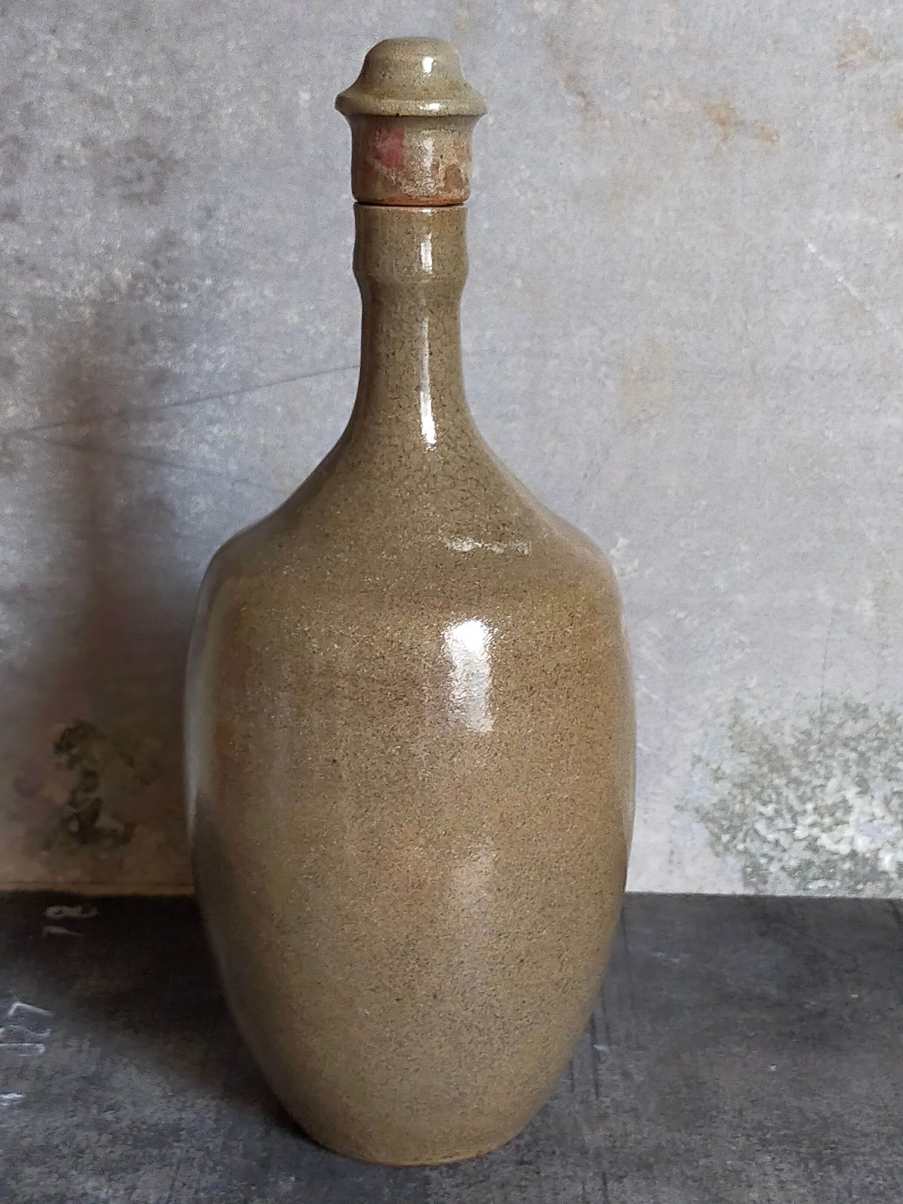 Vintage glazed stoneware potter's liquor bottle
