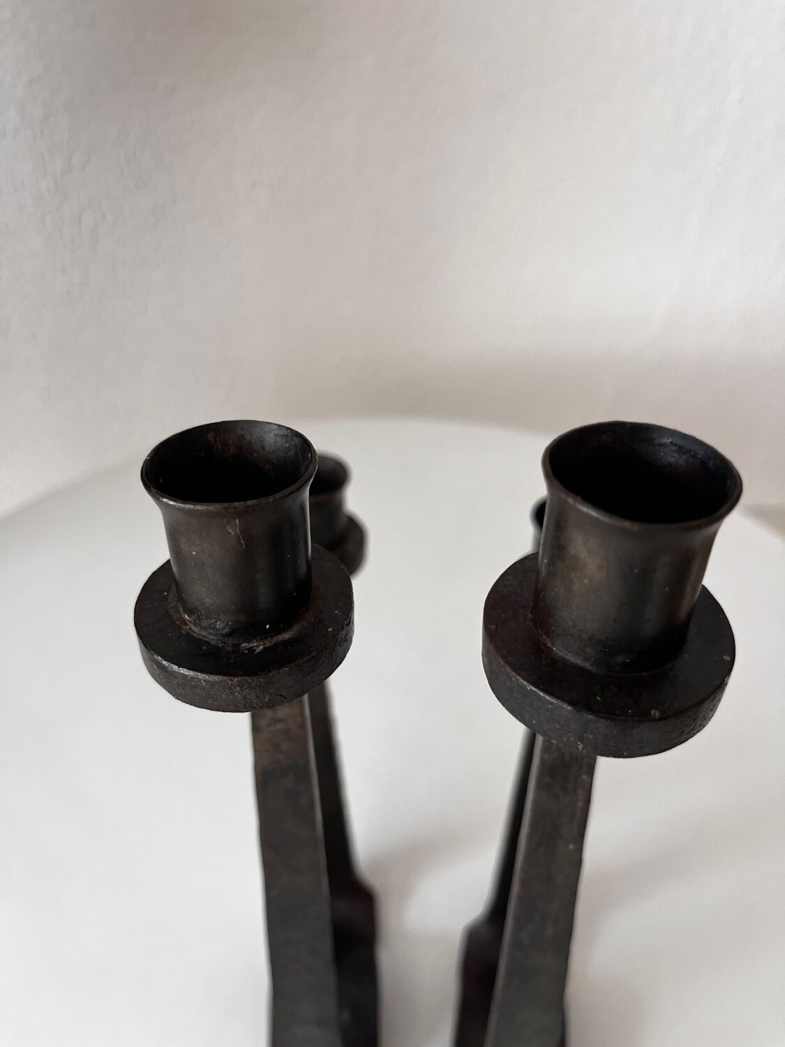 Brutalist wrought iron candlestick pair