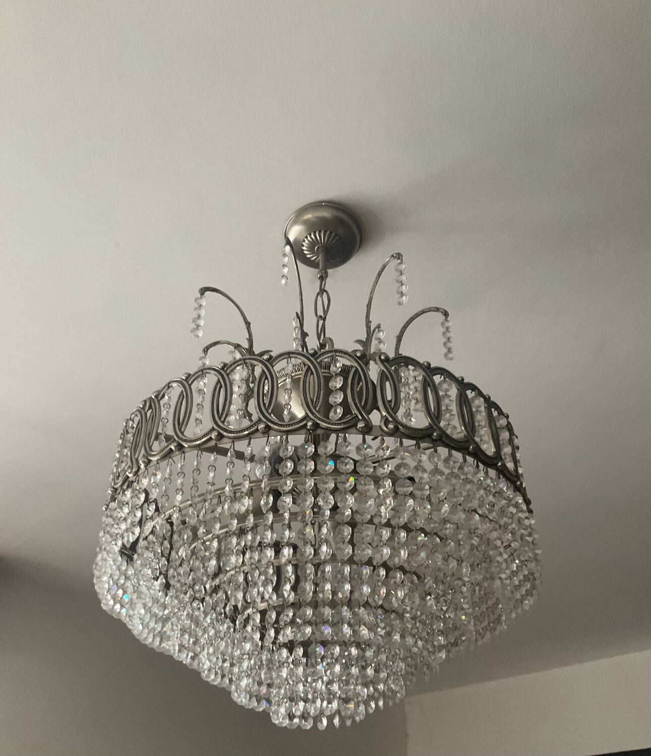 Cascading chandelier with crystal and silvered bronze pendants