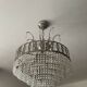 Cascading chandelier with crystal and silvered bronze pendants