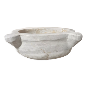 Old basin in white marble