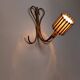 Rattan wall lights by Louis Sognot