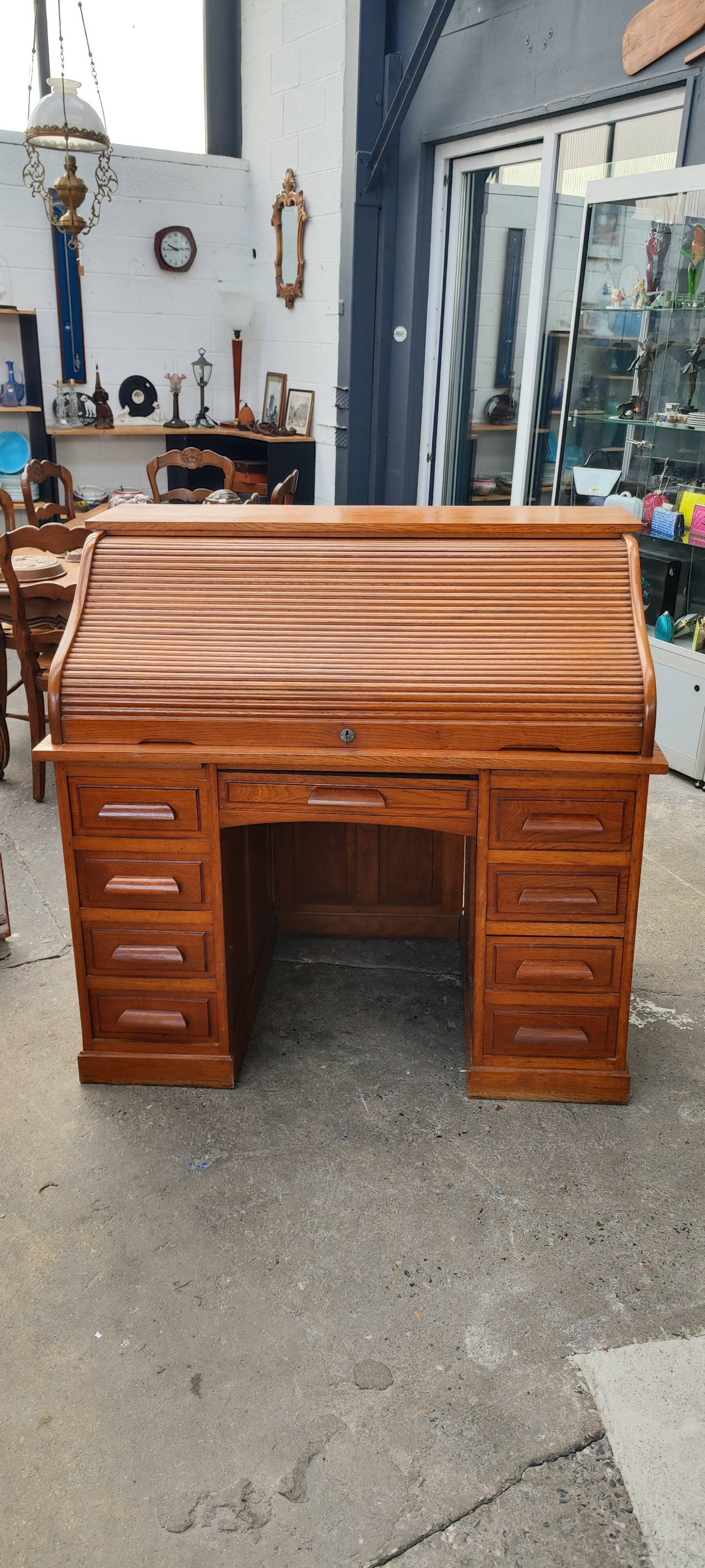 Old American desk in solid oak with S-shaped shutter