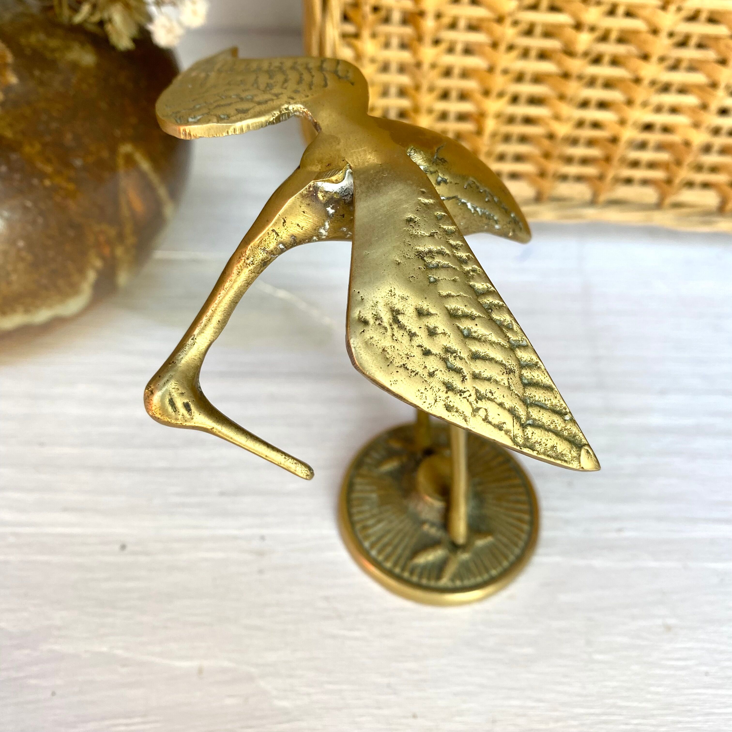Golden brass bird