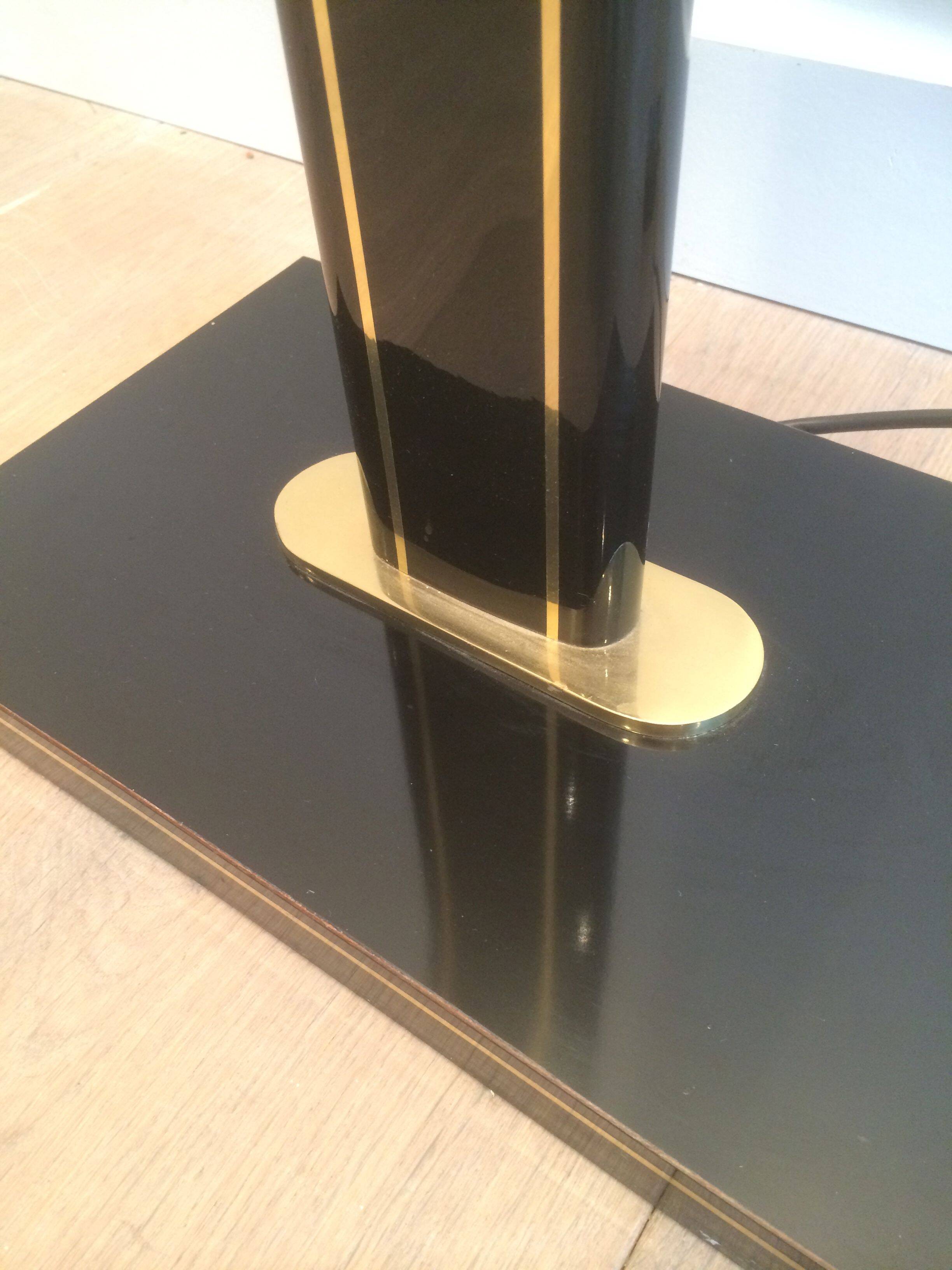 Black lacquered and brass floor lamp