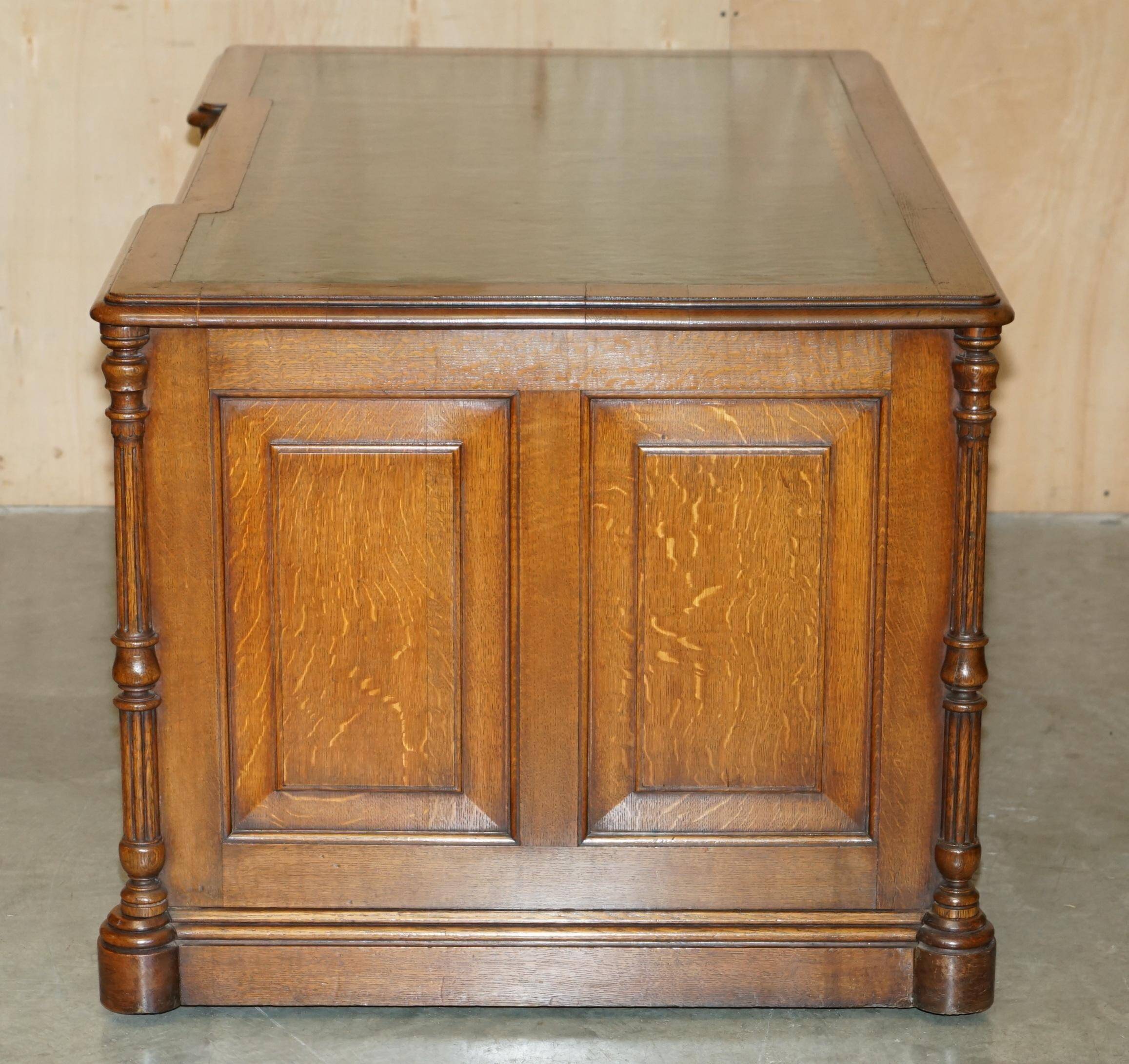 Antique double-sided desk C Hindley & Son in oak and leather