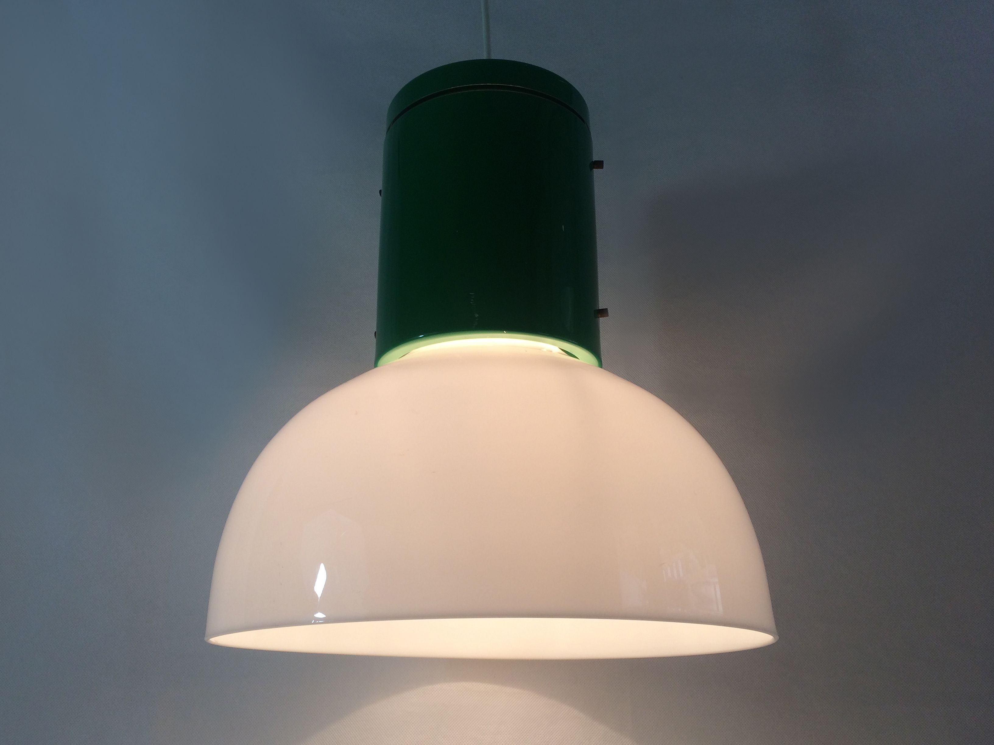 Vintage industrial suspension in green metal and white plastic lampshade. Year 70