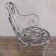 19th-century garden armchair in wrought iron
