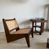 Reclined armchair in canned teak in natural wood