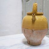 Old gargoulette pot in glazed terracotta