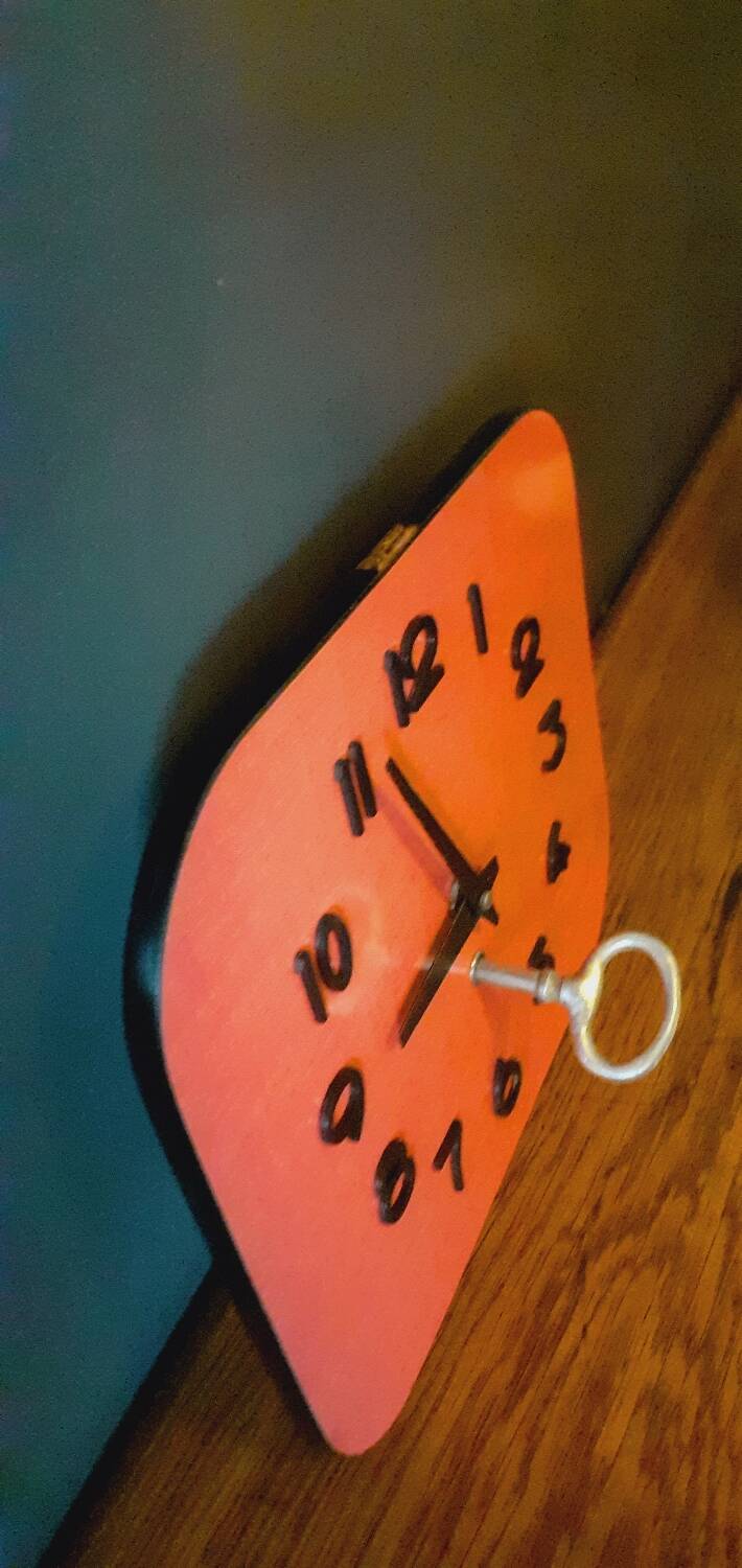 Vintage wall clock from the 50s in red formca