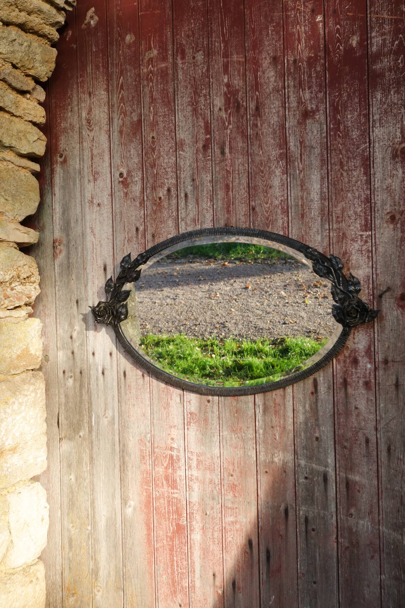Art Deco mirror in wrought iron and beveled glass