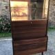 Vintage Scandinavian secretary in rosewood with drawers featuring fin-style handles.