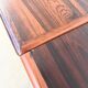 Rosewood dining table with integrated extensions — Denmark, 1960s