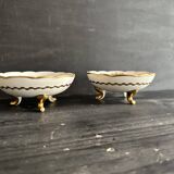 Pair of tripod bowls in gilded Limoges porcelain.
