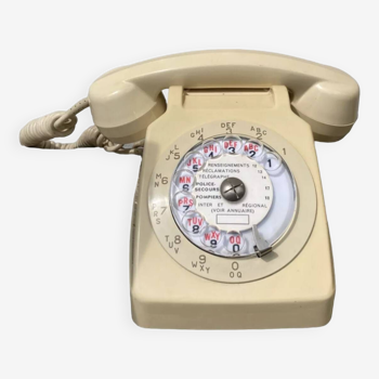Téléphone à cadran beige vintage