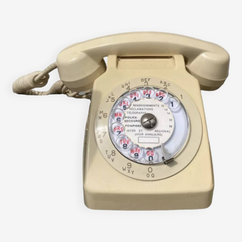 Vintage beige rotary telephone