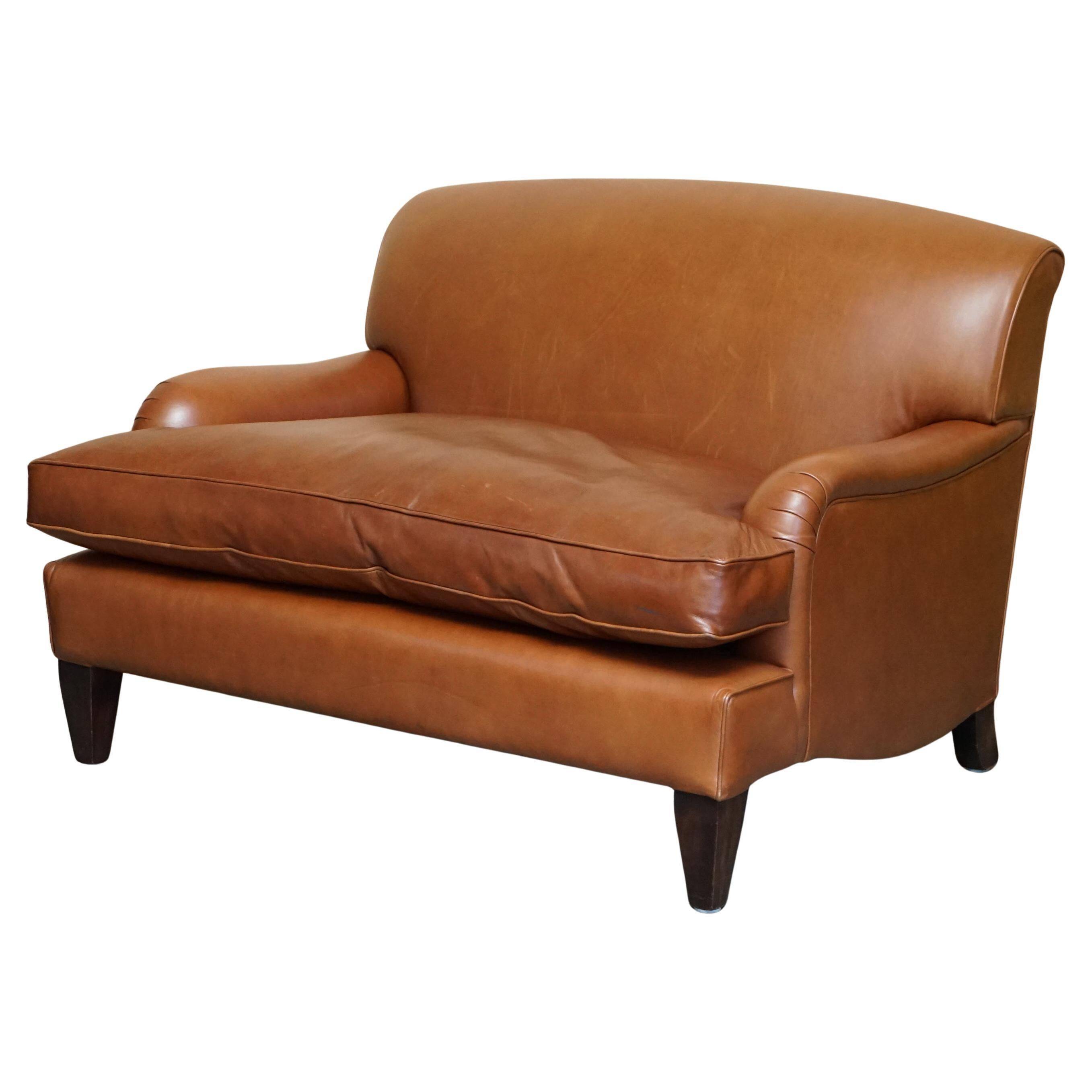 Two-seater leather armchair in Howard style by George Smith.