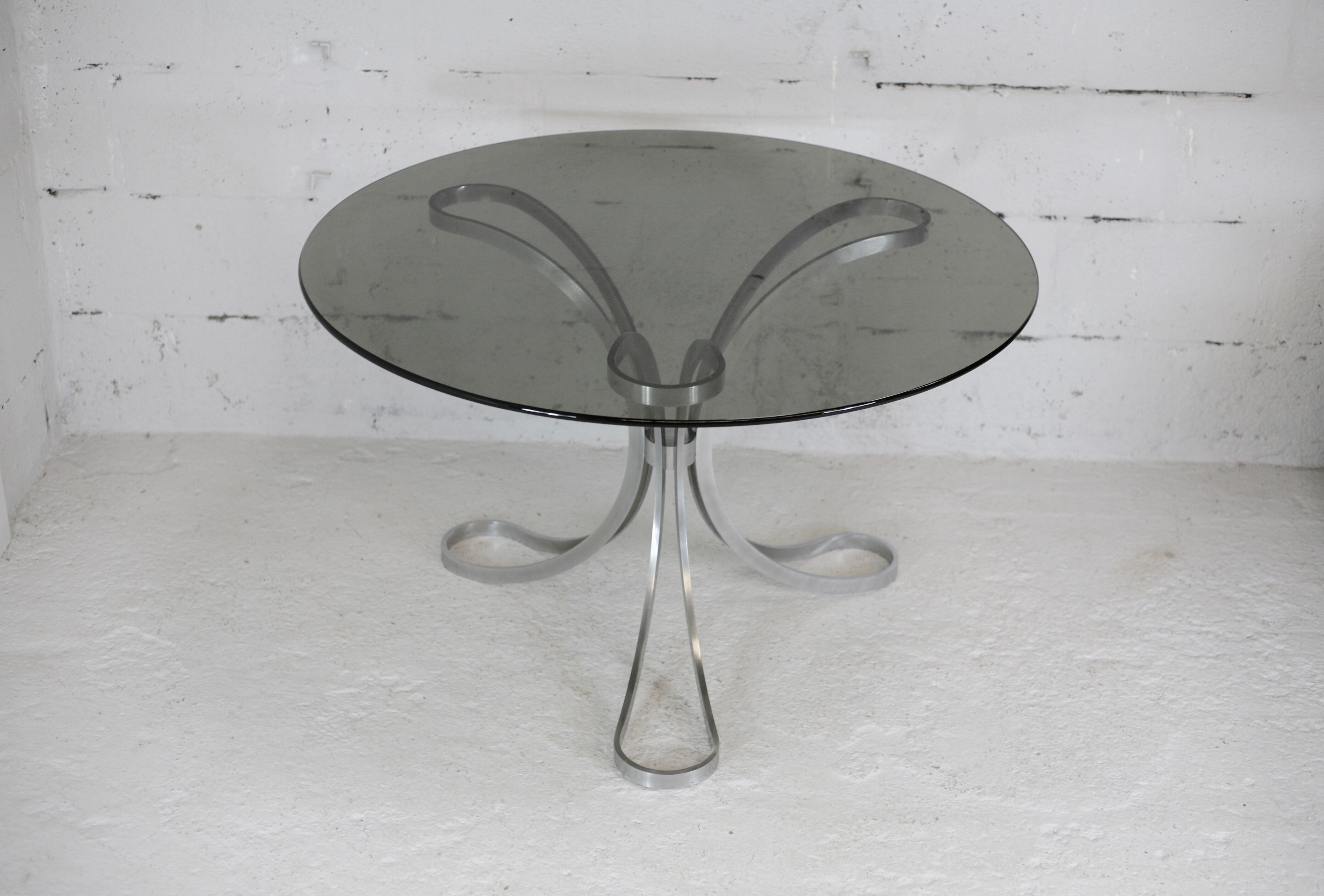 Living room table "Space Age" polished steel, circular slab smoked glass. France, circa 1970.