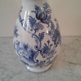 Blue vase adorned with blue and white
