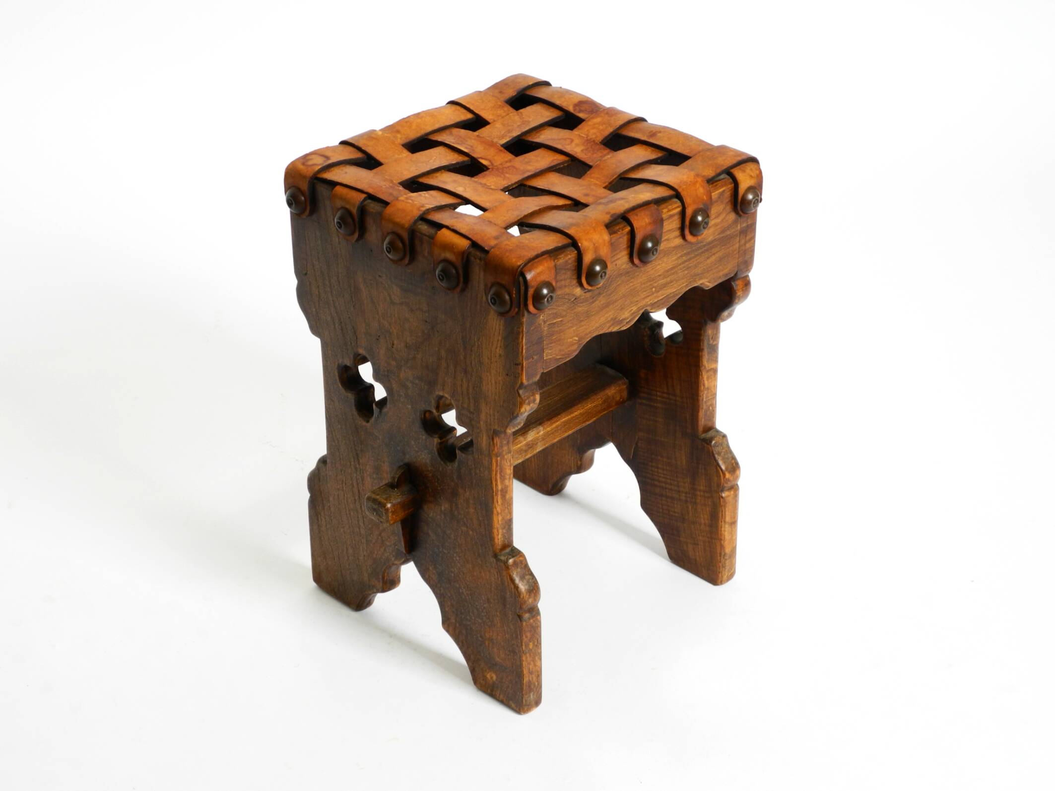 Beautiful 1940s oak stool with a seat made of leather straps