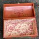 Small Chinese orange wooden flowered jewelry box