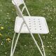 Set of 9 vintage perforated metal folding chairs from the 1970s-80s.