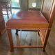 "Frank Lloyd Wright set with a table and its eight chairs."