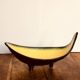 Large Céramidi tripod cup. Yellow and black. Signature incised Céramidi