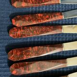 Set of 12 vintage red bakelite knives