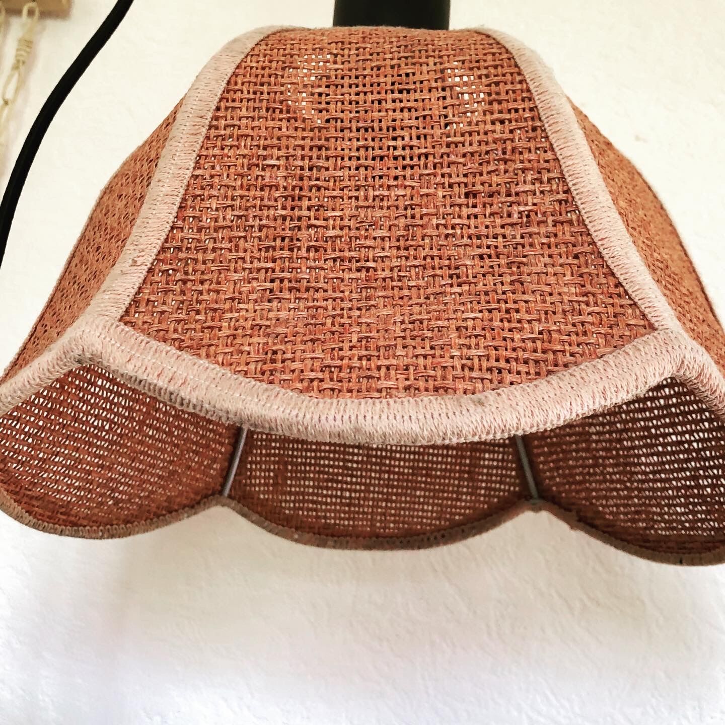 Suspension of woven fiber flowers