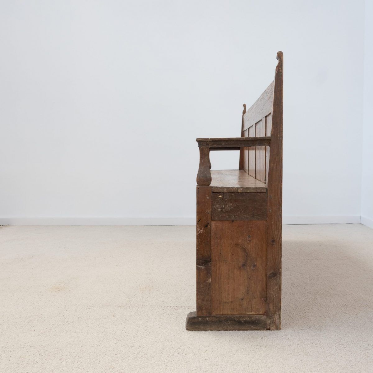 Old wooden bench with panelled backrest – 19th century