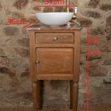 Small antique washbasin in wood and red marble.
