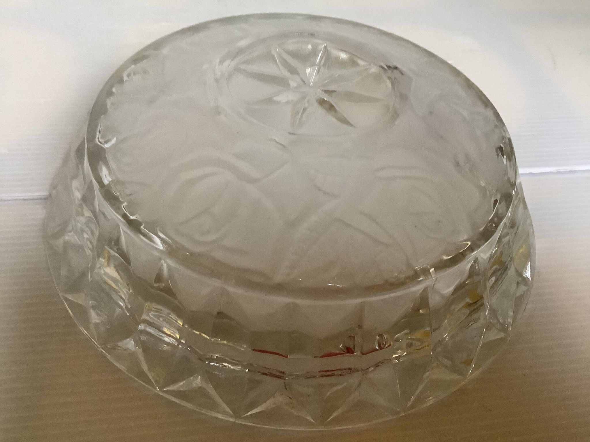 Large glass ashtray with frosted flowers.