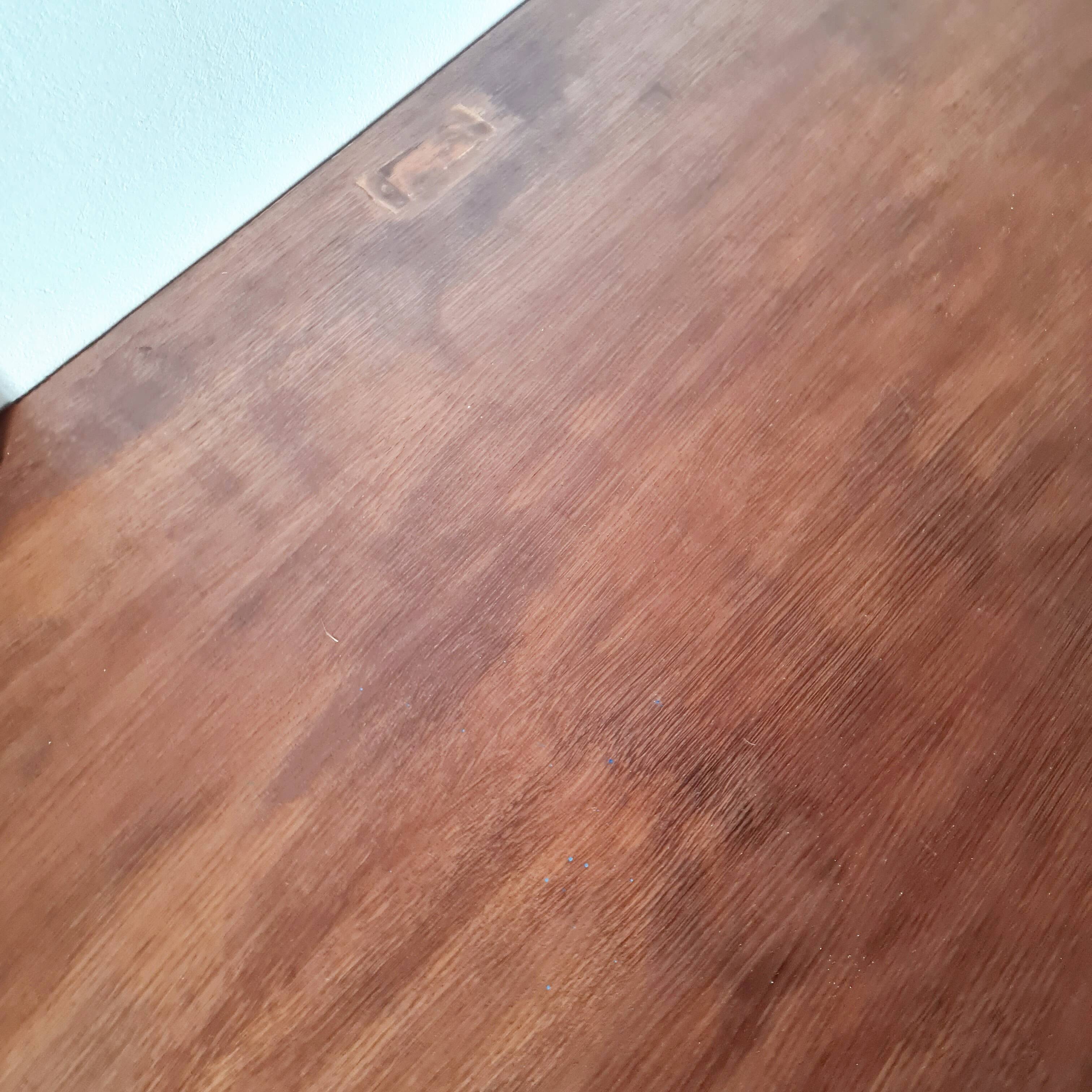 Table with tubular metal legs and wooden top.