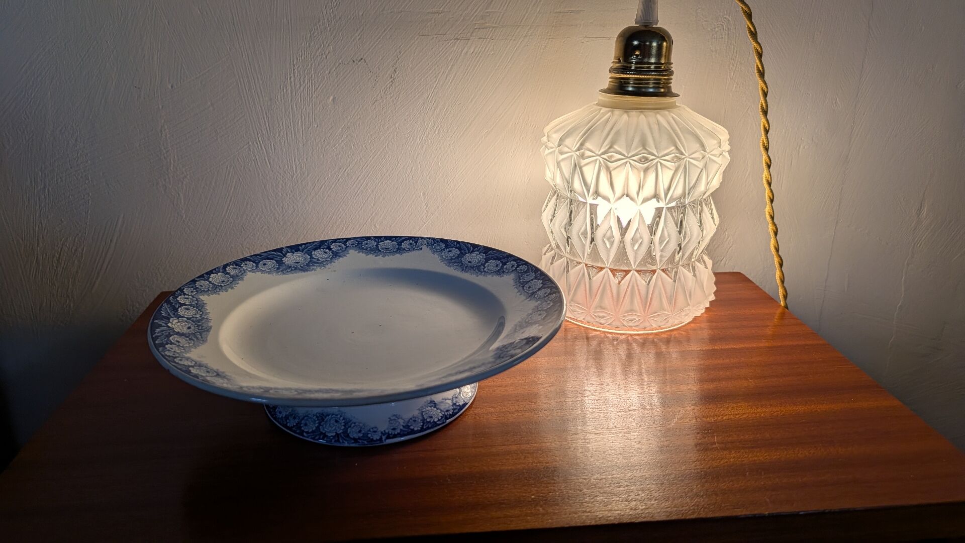 Antique compote dish with blue floral decoration.