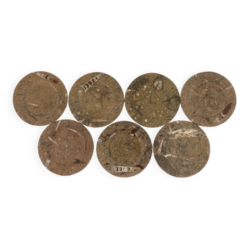 Set of 7 marble plates with fossil inclusions. 20th century.