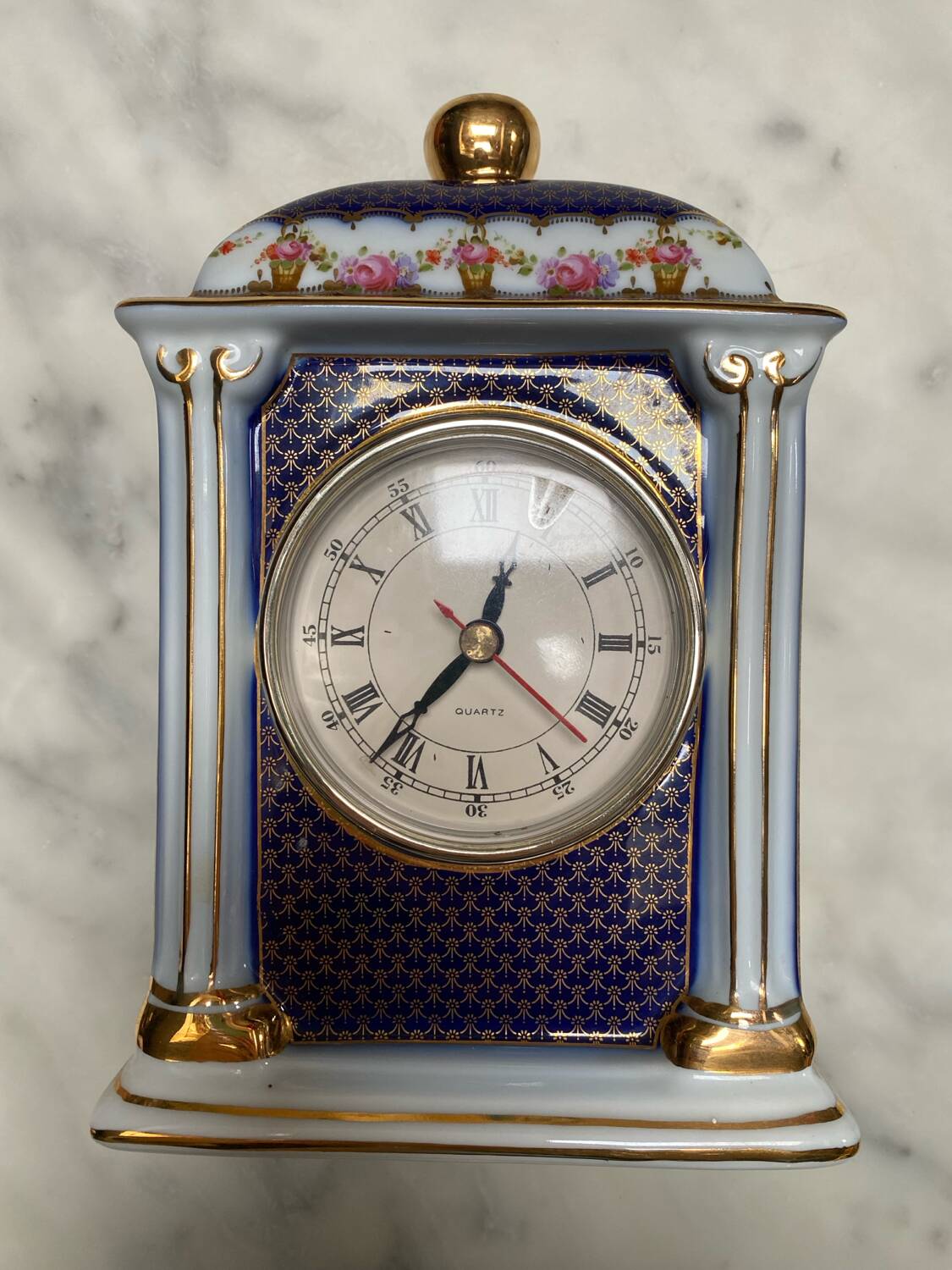 English porcelain clock and candle holders